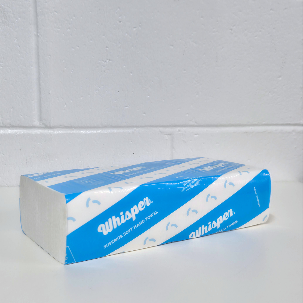 3824 Whisper paper hand towel folded, superior soft hand towel, blue stripped packaging, white virgin wood, white background, white brick wall