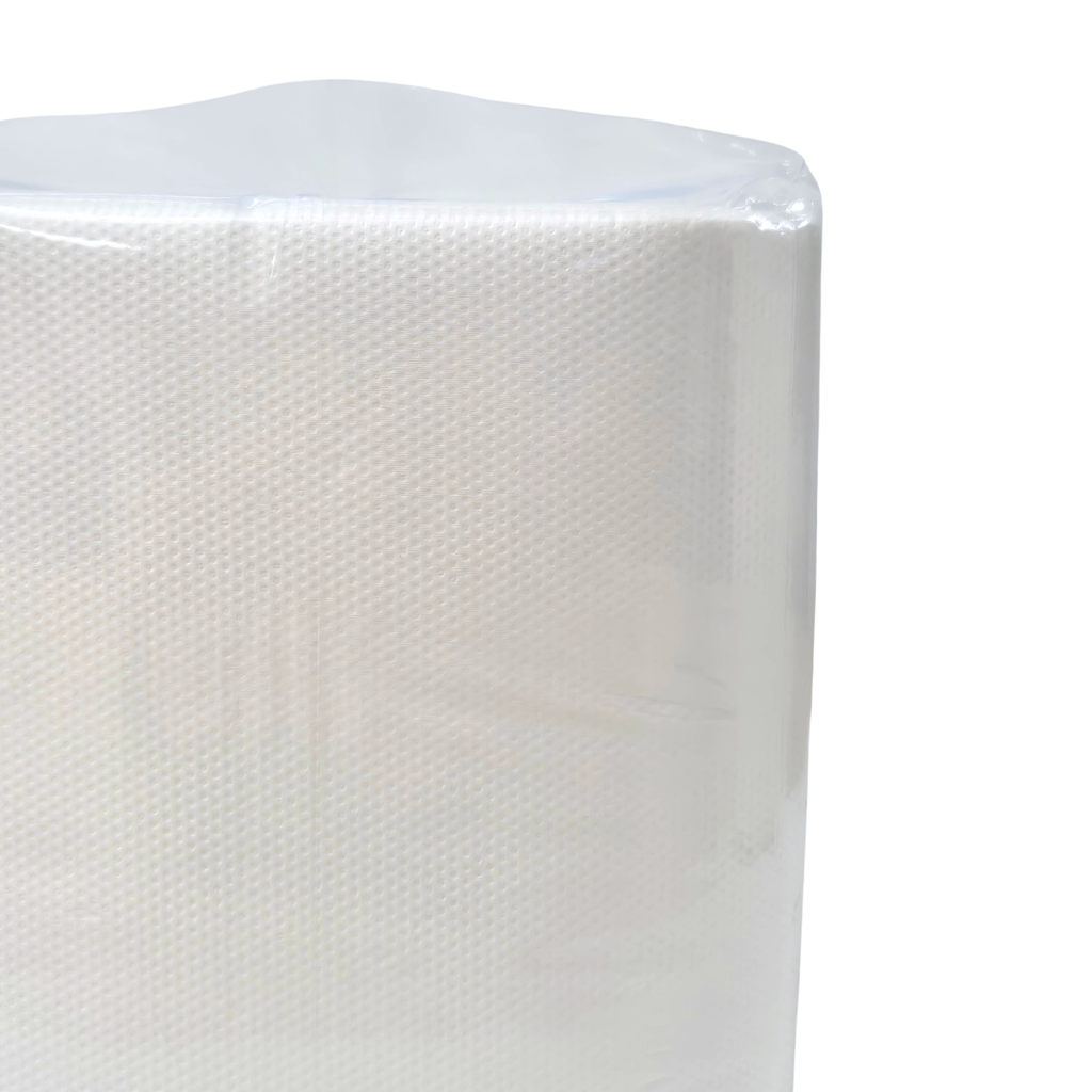 A package of Whisper brand white luncheon napkins, 1 ply, containing 500 napkins. The napkins are wrapped in clear plastic. QT folded napkins. Dot embossing