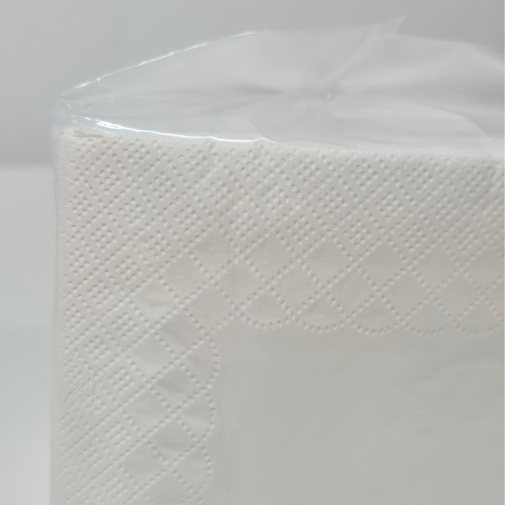 Whisper cocktail napkins, 250 napkins per pack, clear packaging with pink label, QT fold, cocktail glass on front, white cocktail napkins, code 6406, close up of embossing