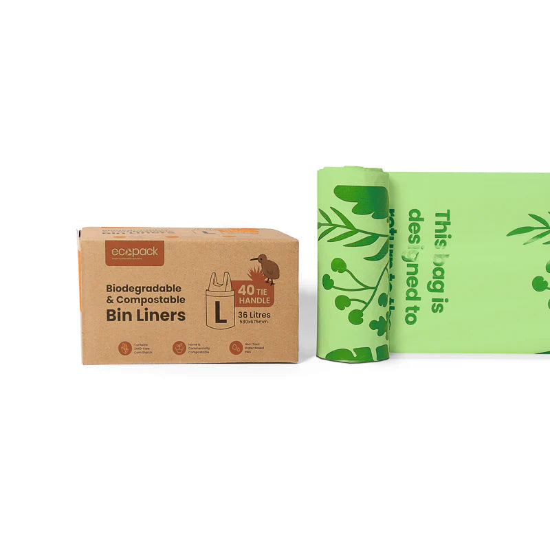 Box of biodegradable bin liners with green bags on a white background