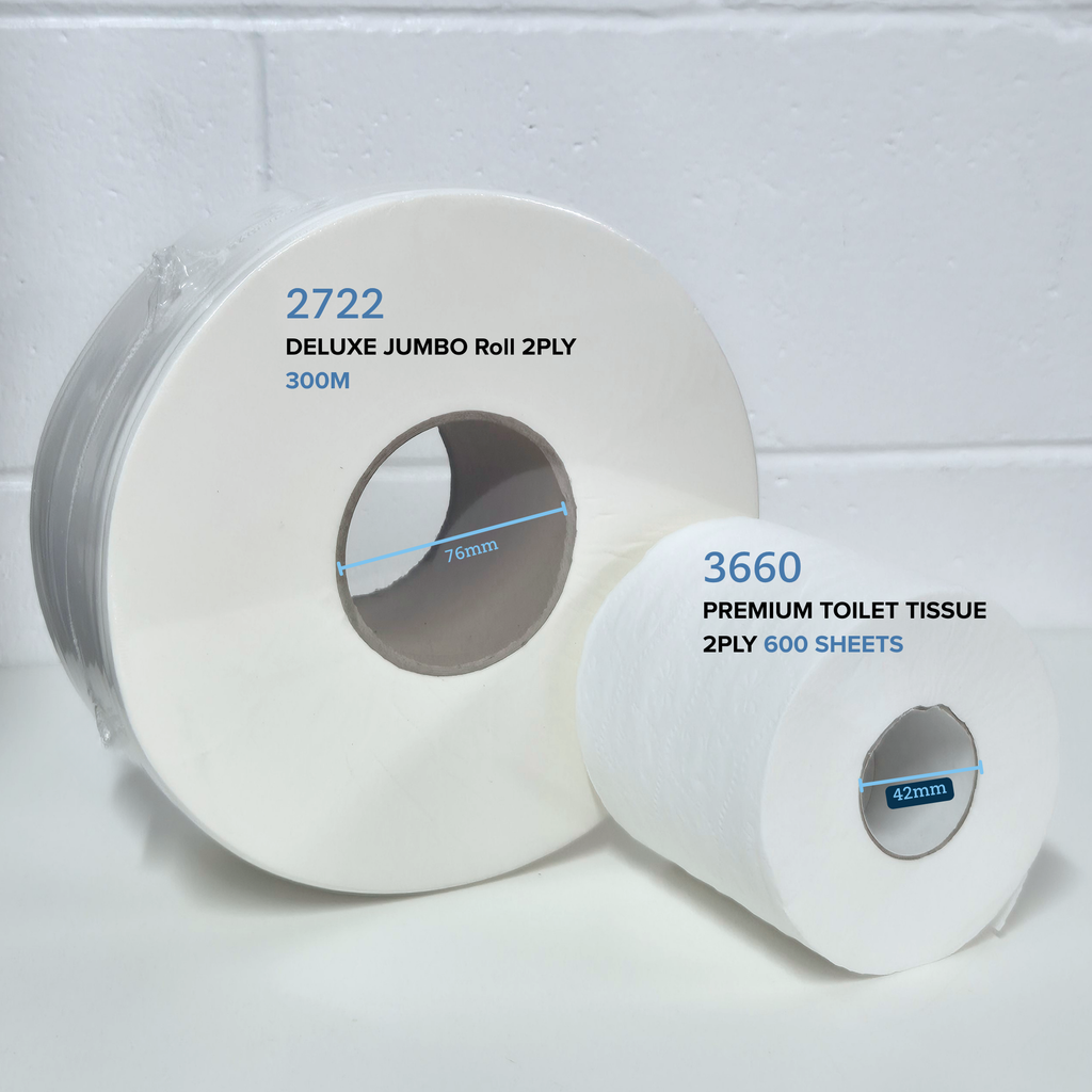 comparison of Whisper 2722 Deluxe Jumbo Roll 2ply 300m and Whisper 3660 premium toilet tissue 2ply 600 sheet next to each other on a white table with white brick in the background
