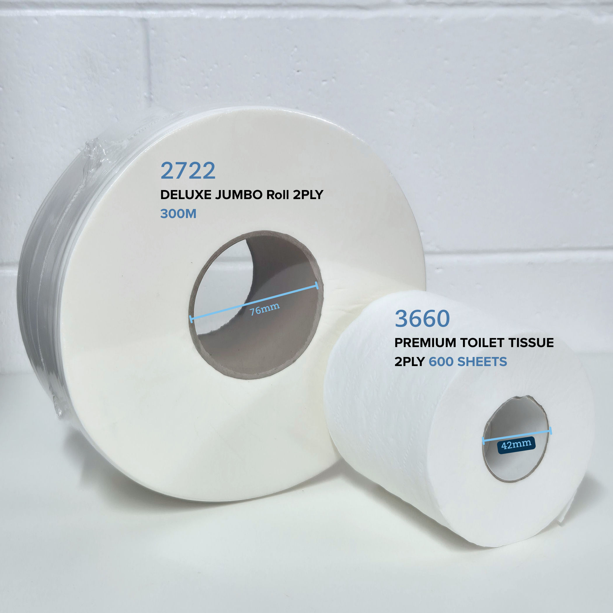 comparison of Whisper 2722 Deluxe Jumbo Roll 2ply 300m and Whisper 3660 premium toilet tissue 2ply 600 sheet next to each other on a white table with white brick in the background