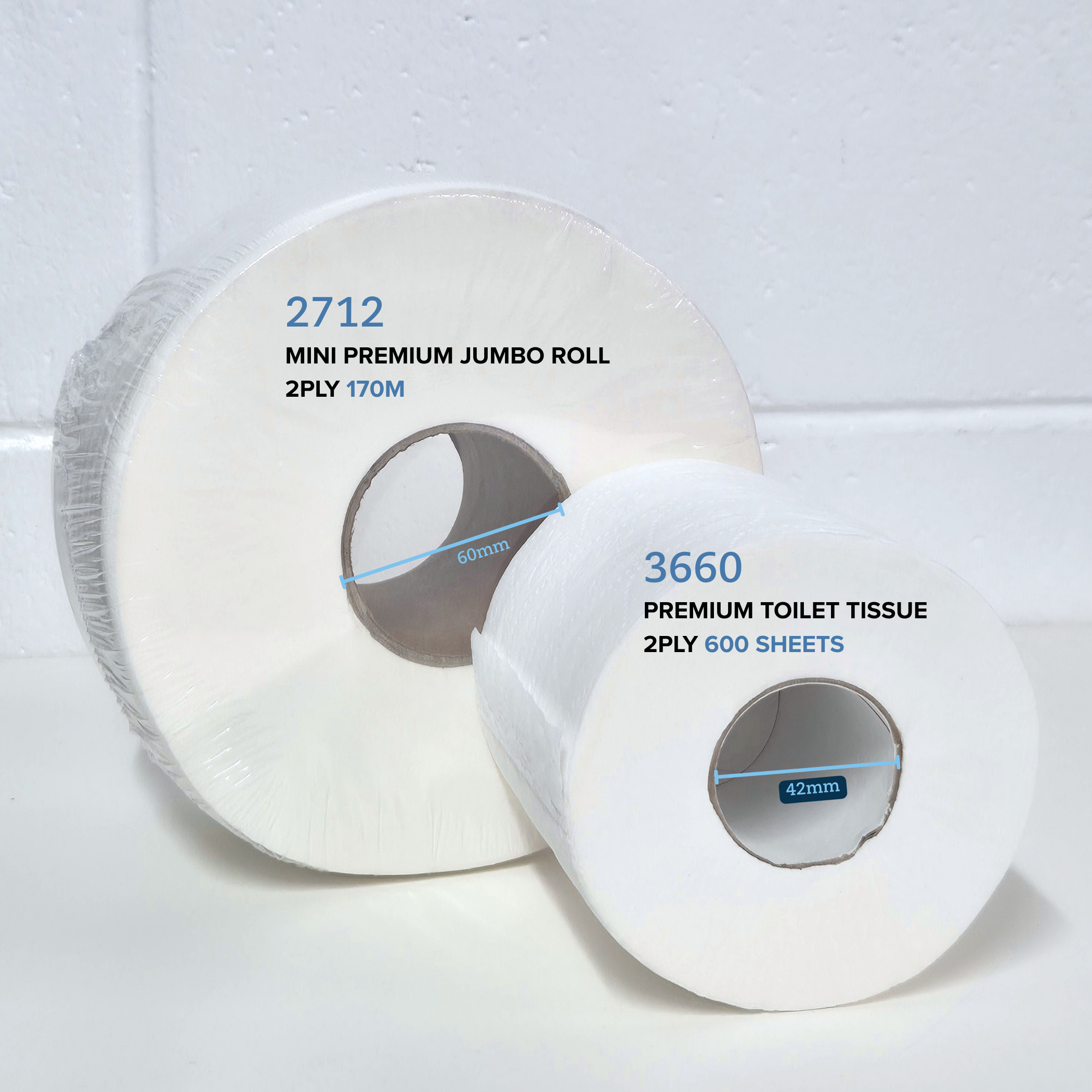 Comparison of Whisper 2712 Mini Premium jumbo roll 2ply 170M and Whisper Premium toilet tissue 2ply 600 sheet on a white table with a white brick background